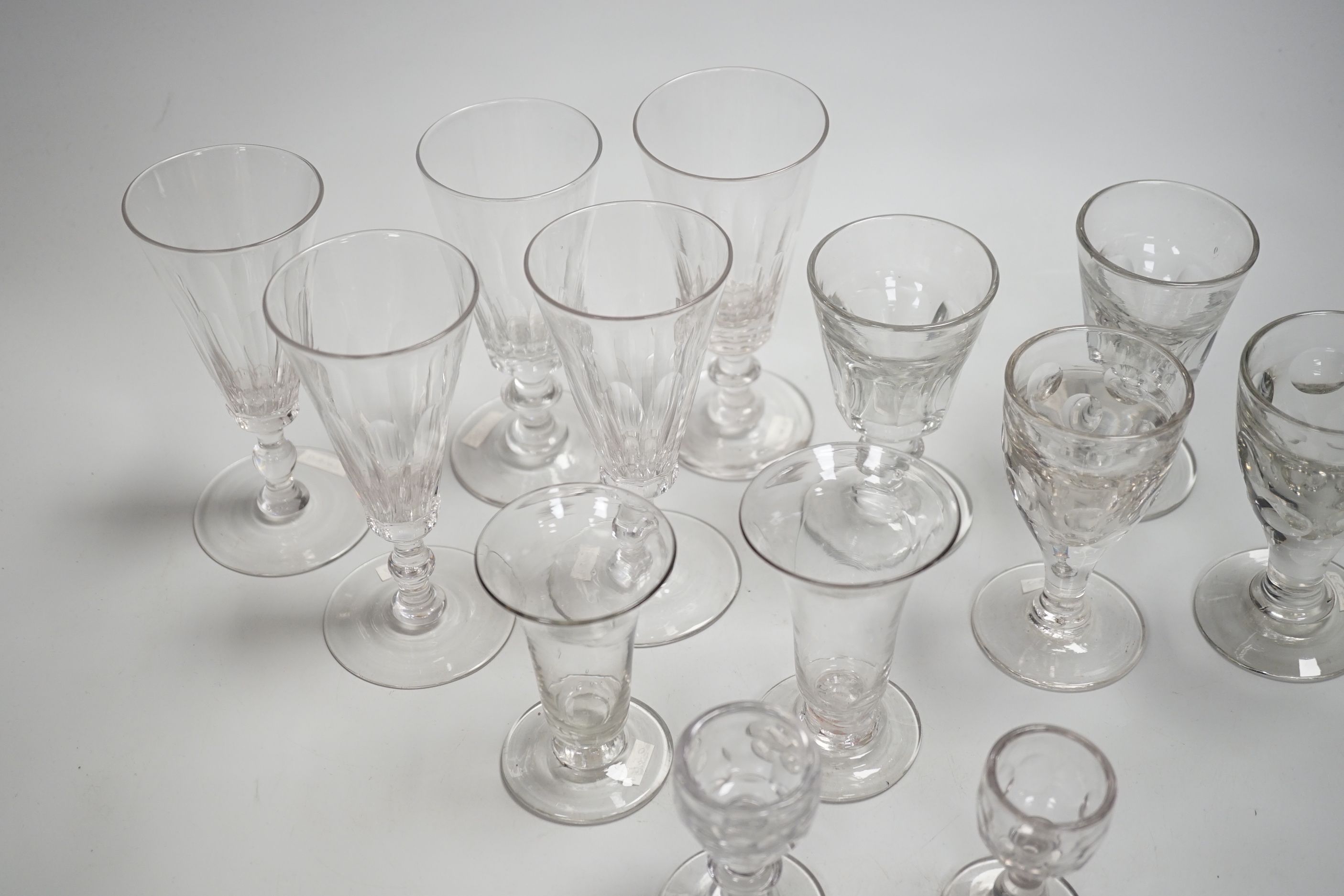 1429, 1430, 1451, 1439 & 1435 A harlequin set of five English lead crystal short ales, c.1820-30, decorated with cut rounded facets, two with blade and three with ball knops, height 14.2cm, together with three pairs of 1